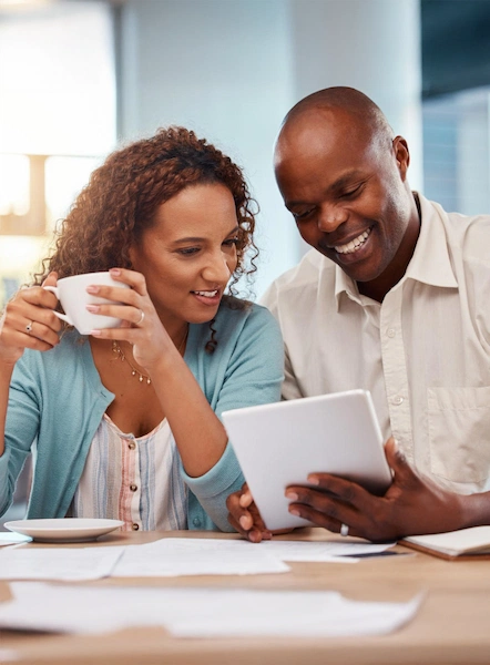 Couple reviewing payday loan options on a tablet at home