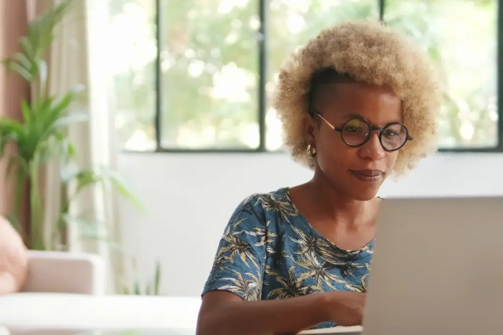 A woman using her laptop to check details of a payday loan in Florida
