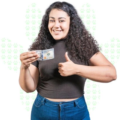 Smiling young woman with curly hair holding a $100 bill and giving a thumbs up, on a white background with a paw print pattern.