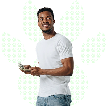 Smiling young man holding money, on a white background with a paw print pattern.