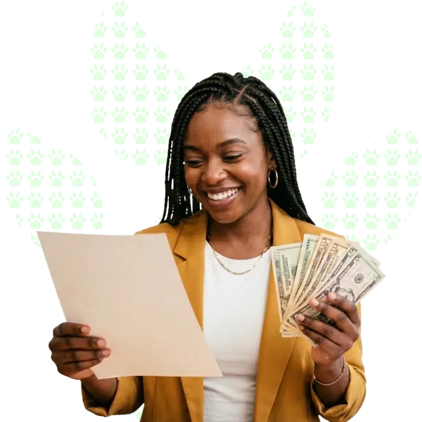 A confident young woman smiling as she checks loan requirements on a document while holding money in her hands